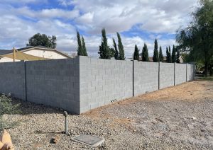 REPLACING PERIMETER WALLS IN DESERT RIDGE: BLOCK AND FOOTING DEBRIS